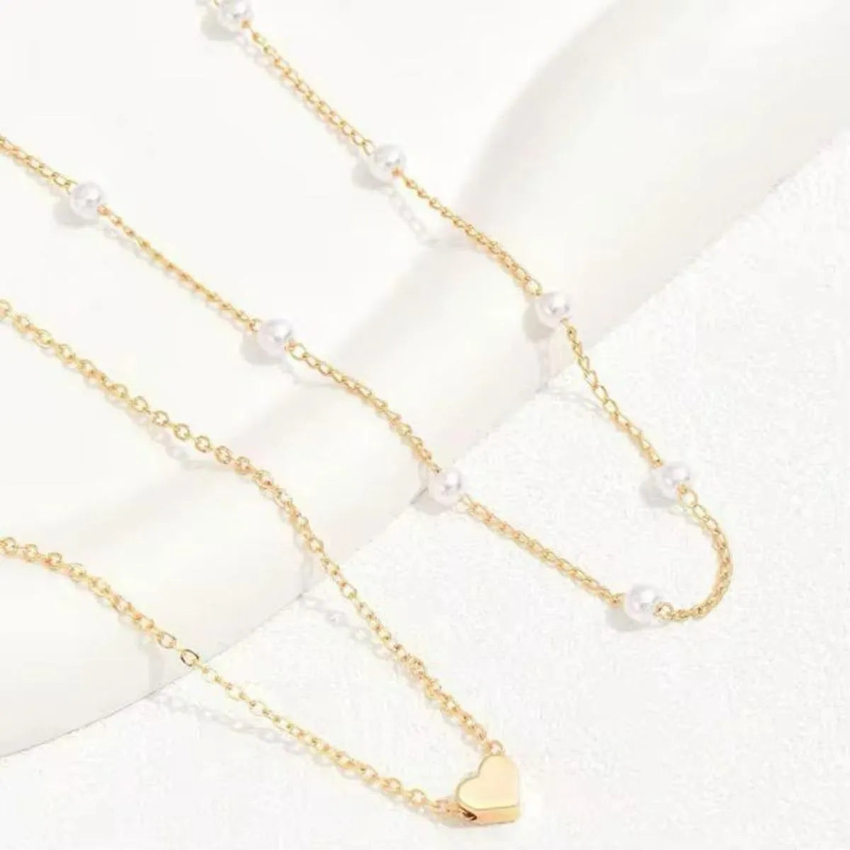Colar Duplo com Pérolas e Pingente de Coração